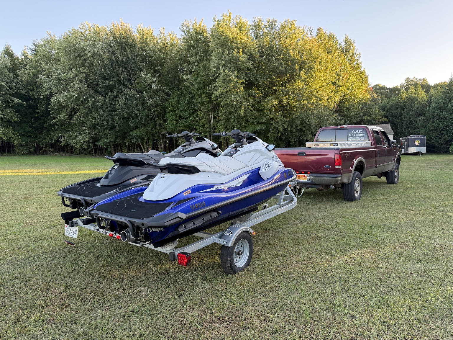 Personal watercraft on a trailer behind a pickup truck